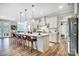 Modern kitchen with white cabinets, large island, and stainless steel appliances at 9428 Liberty Hill Dr, Mint Hill, NC 28227