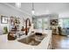 Kitchen island featuring a copper faucet and a stainless steel sink with a view into the living area at 9428 Liberty Hill Dr, Mint Hill, NC 28227