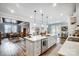 Open concept kitchen with white countertops, a large island, pendant lighting, and stainless steel appliances at 9428 Liberty Hill Dr, Mint Hill, NC 28227