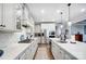 Modern kitchen with white cabinets, large island, and stainless steel appliances at 9428 Liberty Hill Dr, Mint Hill, NC 28227