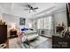 Comfortable main bedroom featuring tray ceiling, natural light, and elegant furnishings at 9428 Liberty Hill Dr, Mint Hill, NC 28227