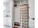 Well-organized mudroom with custom storage and decorative shower curtain at 9428 Liberty Hill Dr, Mint Hill, NC 28227