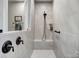 Modern tiled walk-in shower with bench seating and bronze shower hardware at 9428 Liberty Hill Dr, Mint Hill, NC 28227