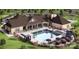 Community outdoor pool with lounge chairs, tables, umbrellas, and nearby tennis courts at 9428 Liberty Hill Dr, Mint Hill, NC 28227