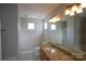 Bathroom with granite countertop and bathtub at 9445 Meadowmont View Dr # 137, Charlotte, NC 28269