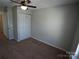 Bedroom with carpet, ceiling fan, and double door closet at 9445 Meadowmont View Dr # 137, Charlotte, NC 28269