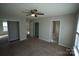 Bedroom with carpet, ceiling fan, and mirrored closet doors at 9445 Meadowmont View Dr # 137, Charlotte, NC 28269