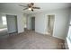 Carpeted bedroom with mirrored closet doors and access to bathroom at 9445 Meadowmont View Dr # 137, Charlotte, NC 28269