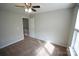 Carpeted bedroom with ceiling fan and double closets at 9445 Meadowmont View Dr # 137, Charlotte, NC 28269