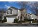 Two-story house with attached garage and landscaping at 9445 Meadowmont View Dr # 137, Charlotte, NC 28269