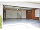 Spacious garage with painted floor, shelving, and access door at 9445 Meadowmont View Dr # 137, Charlotte, NC 28269