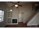 Living room with fireplace, high ceilings, and hardwood floors at 9445 Meadowmont View Dr # 137, Charlotte, NC 28269