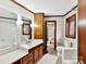 Bathroom with double vanity and separate tub and toilet area at 955 Brafford Dr, Concord, NC 28025