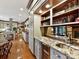 Kitchen wet bar with granite countertop and wine cooler at 955 Brafford Dr, Concord, NC 28025