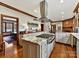 Spacious kitchen with granite counters, island, and stainless steel appliances at 955 Brafford Dr, Concord, NC 28025