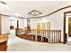 Elegant upper hallway with wood railings and stained-glass skylight at 955 Brafford Dr, Concord, NC 28025