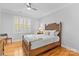 Bedroom with wooden bed frame and hardwood floors at 1009 Davant Ln, Charlotte, NC 28209