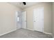 Well-lit bedroom with carpet flooring and door to another room at 101 Bungalow Dr, Rock Hill, SC 29732