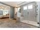 Modern bathroom features a glass shower with marble-look tile, built-in bench, and neutral gray tile flooring at 102 Ellsworth Rd # 43, Mooresville, NC 28115