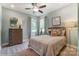 Comfortable bedroom with ceiling fan, two windows and neutral decor at 102 Ellsworth Rd # 43, Mooresville, NC 28115