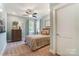 Comfortable bedroom with ceiling fan, two windows and neutral decor at 102 Ellsworth Rd # 43, Mooresville, NC 28115