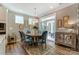 Cozy dining room with stylish light fixture, decorative wall art, and outdoor patio access at 102 Ellsworth Rd # 43, Mooresville, NC 28115