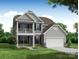Charming two-story home featuring a stone facade, inviting balcony, and well-manicured lawn at 102 Ellsworth Rd # 43, Mooresville, NC 28115