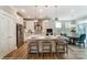 Bright kitchen featuring stainless steel appliances, quartz counters, island with seating, and modern lighting at 102 Ellsworth Rd # 43, Mooresville, NC 28115