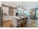 Bright kitchen with stainless steel appliances, quartz counters, an island with seating, and modern lighting at 102 Ellsworth Rd # 43, Mooresville, NC 28115