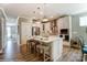 Bright kitchen with white cabinets, stainless steel appliances, a large island, and hardwood floors at 102 Ellsworth Rd # 43, Mooresville, NC 28115