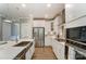 Bright kitchen with stainless steel appliances, an island sink, white cabinets, and a modern design at 102 Ellsworth Rd # 43, Mooresville, NC 28115