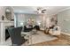 Elegant living room with fireplace, decorative panel wall, and modern furniture at 102 Ellsworth Rd # 43, Mooresville, NC 28115