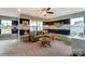 Bright living room with large windows, comfortable sectional sofa and stylish decor at 102 Ellsworth Rd # 43, Mooresville, NC 28115