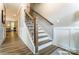 Elegant staircase with wood and iron detailing, connecting levels of the home at 102 Ellsworth Rd # 43, Mooresville, NC 28115