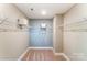 Spacious walk-in closet with wrap around shelving and carpeting, creating an organized storage solution at 102 Ellsworth Rd # 43, Mooresville, NC 28115