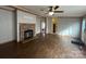 Living room with fireplace, hardwood floors and view into kitchen at 104 Freeze Meadow Rd, China Grove, NC 28023