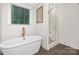 Elegant bathroom featuring a soaking tub and walk-in shower at 125 S Gregg St, Charlotte, NC 28208