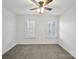 Bright bedroom with neutral walls and plantation shutters at 16908 Bridgewalk Dr, Charlotte, NC 28277