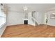 Spacious living area with hardwood floors and a cozy fireplace at 2944 Caldwell Ridge Pkwy, Charlotte, NC 28213