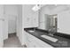 Modern bathroom featuring double vanity sinks, sleek countertops, a large mirror, and glass-enclosed shower at 3116 Beacon Heights Rd, Indian Land, SC 29707