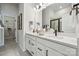Double vanity bathroom with modern fixtures and a large mirror at 3116 Beacon Heights Rd, Indian Land, SC 29707