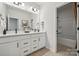 Clean bathroom with double vanity, modern fixtures, and tub shower combo at 3116 Beacon Heights Rd, Indian Land, SC 29707