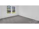 Bright bedroom with large windows and neutral carpeting, offering a serene space at 3116 Beacon Heights Rd, Indian Land, SC 29707