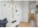 Bright entry with built-in bench, hooks, and stylish flooring at 3116 Beacon Heights Rd, Indian Land, SC 29707