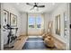 Home gym with exercise bike and yoga mats, hardwood floors and natural light at 3116 Beacon Heights Rd, Indian Land, SC 29707