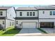 Modern townhome exterior featuring a two-car garage and well-maintained landscaping at 3116 Beacon Heights Rd, Indian Land, SC 29707