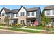 Inviting townhome with brick and siding, landscaped front yard, and community signage at 3116 Beacon Heights Rd, Indian Land, SC 29707