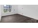 Spacious living room with wood floors and lots of natural light at 3116 Beacon Heights Rd, Indian Land, SC 29707