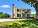 Two-story white house with brown shutters and a brick chimney; large tree in front at 3433 Grey Rd, Davidson, NC 28036
