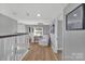 Upstairs hallway with comfortable seating area and natural light at 3433 Grey Rd, Davidson, NC 28036